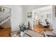 Bright living room with hardwood floors and view into dining space, creates a comfortable and stylish living area at 424 S Pennsylvania St, Denver, CO 80209