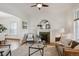Inviting living room features a charming fireplace, ceiling fan, and comfortable seating, ideal for relaxation at 424 S Pennsylvania St, Denver, CO 80209