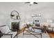 Charming living room with fireplace, decorative window, and comfortable seating, creating a cozy and inviting space at 424 S Pennsylvania St, Denver, CO 80209