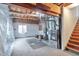 Unfinished basement with exposed ductwork, utility installations, and carpeted area at 20308 E 46Th Ave, Denver, CO 80249