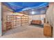 Unfinished basement with shelving, carpet, and some furniture, ready for customization at 20308 E 46Th Ave, Denver, CO 80249