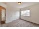 Bedroom with carpet, a window, and a sliding-door closet with ample storage space at 20308 E 46Th Ave, Denver, CO 80249