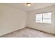 Cozy bedroom with carpet, a window providing natural light and a view of neighborhood at 20308 E 46Th Ave, Denver, CO 80249