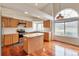 Bright kitchen with an island, stainless steel appliances, and a large window at 20308 E 46Th Ave, Denver, CO 80249