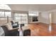 Spacious living room with hardwood floors, large windows and cozy seating at 20308 E 46Th Ave, Denver, CO 80249