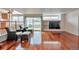 Cozy living room with hardwood floors, large windows, and stylish decor at 20308 E 46Th Ave, Denver, CO 80249