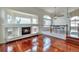 Inviting living room featuring a fireplace and gleaming hardwood flooring at 20308 E 46Th Ave, Denver, CO 80249