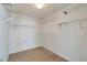 Spacious walk-in closet featuring carpeted floors, overhead lighting, and metal shelving for optimal storage at 20308 E 46Th Ave, Denver, CO 80249