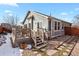 The backyard includes a wooden deck, access to the home, and low maintenance landscaping at 20500 E Hamilton Ave, Aurora, CO 80013
