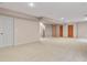 Large basement with carpet and multiple doors and recessed lights is suitable for a playroom at 20500 E Hamilton Ave, Aurora, CO 80013