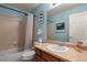 Blue bathroom with a shower, tub, vanity, and framed art creates a serene and inviting atmosphere at 20500 E Hamilton Ave, Aurora, CO 80013