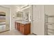 Bright bathroom with a double sink vanity, large mirror and plenty of storage at 20500 E Hamilton Ave, Aurora, CO 80013