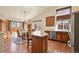 Bright dining area featuring hardwood floors, large windows and easy access to the kitchen at 20500 E Hamilton Ave, Aurora, CO 80013
