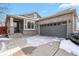 Charming exterior of a ranch-style home with gray siding and a spacious two-car attached garage at 20500 E Hamilton Ave, Aurora, CO 80013