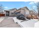 The front exterior offers well-maintained landscaping, brick facade, and an attached garage at 20500 E Hamilton Ave, Aurora, CO 80013