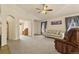 Bright living room with neutral tones, a ceiling fan and an abundance of natural light at 20500 E Hamilton Ave, Aurora, CO 80013