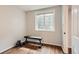 Bright basement gym area with hardwood floors and a large window at 9879 Sydney Ln, Highlands Ranch, CO 80130