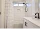 Bathroom with white subway tile, modern fixtures, and vanity at 9879 Sydney Ln, Highlands Ranch, CO 80130