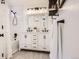 Bathroom featuring double vanity, decorative mirror and modern finishes at 9879 Sydney Ln, Highlands Ranch, CO 80130