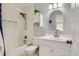 Bathroom with a shower over tub, white cabinets and nautical decor at 9879 Sydney Ln, Highlands Ranch, CO 80130