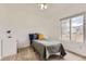 Bright bedroom with a twin bed, desk, and nice window at 9879 Sydney Ln, Highlands Ranch, CO 80130