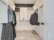 Walk-in closet with installed shelving and hanging rods for ample storage at 9879 Sydney Ln, Highlands Ranch, CO 80130