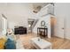 Bright living room featuring hardwood floors, a staircase, and an open layout perfect for entertaining and relaxing at 9879 Sydney Ln, Highlands Ranch, CO 80130