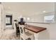 Lofted office space with a built-in wooden desk and neighborhood views at 9879 Sydney Ln, Highlands Ranch, CO 80130
