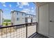 View of a modern townhouse complex from a balcony, showing multiple units and landscaping at 457 Interlocken Blvd # 105, Broomfield, CO 80021
