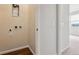 Hallway access to utilities, laundry room, and additional living spaces at 457 Interlocken Blvd # 105, Broomfield, CO 80021