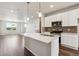 Open kitchen with a spacious island, stainless appliances, and modern finishes at 457 Interlocken Blvd # 105, Broomfield, CO 80021