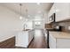 Modern kitchen with a spacious island, stainless appliances, and open floor plan at 457 Interlocken Blvd # 105, Broomfield, CO 80021