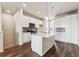 Bright kitchen with a large island, stainless appliances, and sleek white cabinetry at 457 Interlocken Blvd # 105, Broomfield, CO 80021