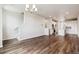 Spacious living room featuring hardwood floors and an open layout to the kitchen at 457 Interlocken Blvd # 105, Broomfield, CO 80021