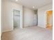 Large bedroom with plush carpeting, walk-in closet and ensuite access at 457 Interlocken Blvd # 105, Broomfield, CO 80021
