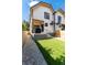 Large backyard with a grassy lawn and gravel pathway at 2478 S Lafayette St, Denver, CO 80210