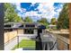 Charming backyard with a grassy lawn, patio, and string lights at 2478 S Lafayette St, Denver, CO 80210
