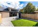 Neat backyard with a grassy lawn and a shed at 2478 S Lafayette St, Denver, CO 80210