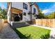 Modern backyard with a grassy lawn and gravel pathway at 2478 S Lafayette St, Denver, CO 80210