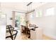 Bright dining room features a rustic wood table and modern light fixture at 2478 S Lafayette St, Denver, CO 80210