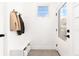 Bright entryway with built-in bench, storage, and coat hooks at 2478 S Lafayette St, Denver, CO 80210