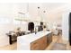 Modern kitchen island with white countertop and wooden base at 2478 S Lafayette St, Denver, CO 80210