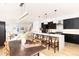 Modern kitchen with white quartz island and black cabinetry at 2478 S Lafayette St, Denver, CO 80210
