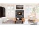 Bright living room with a modern fireplace, large windows, and comfortable seating at 2478 S Lafayette St, Denver, CO 80210
