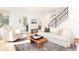 Living area with a light and airy feel, featuring a fireplace and ample seating at 2478 S Lafayette St, Denver, CO 80210