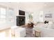 Spacious living room with a modern fireplace, large windows, and comfortable seating at 2478 S Lafayette St, Denver, CO 80210