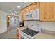 Well-equipped kitchen seamlessly integrated with living space and featuring modern appliances at 17034 E Tennessee Dr # 106, Aurora, CO 80017