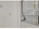 Laundry area featuring a stacked washer and dryer unit at 17034 E Tennessee Dr # 106, Aurora, CO 80017