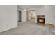 Cozy living room with a fireplace, carpet, and ample space at 17034 E Tennessee Dr # 106, Aurora, CO 80017