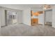 Open-concept living area seamlessly connecting to the kitchen and patio at 17034 E Tennessee Dr # 106, Aurora, CO 80017